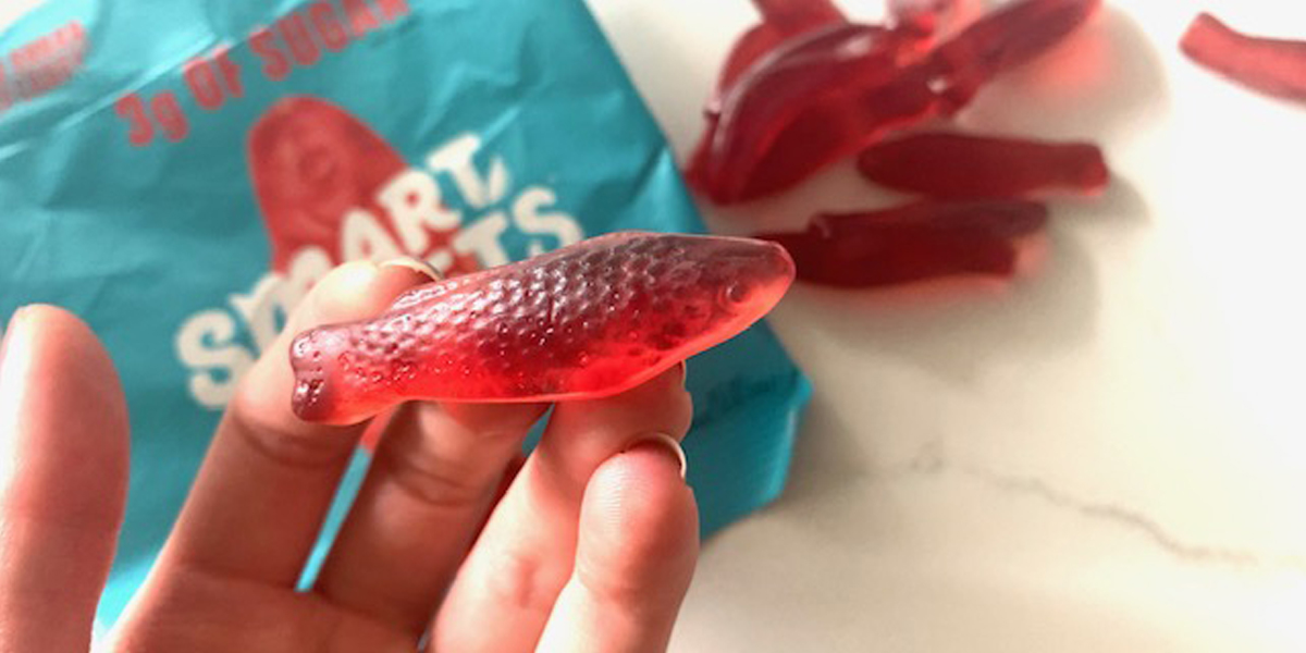 Holding a Smart Sweets sweet fish